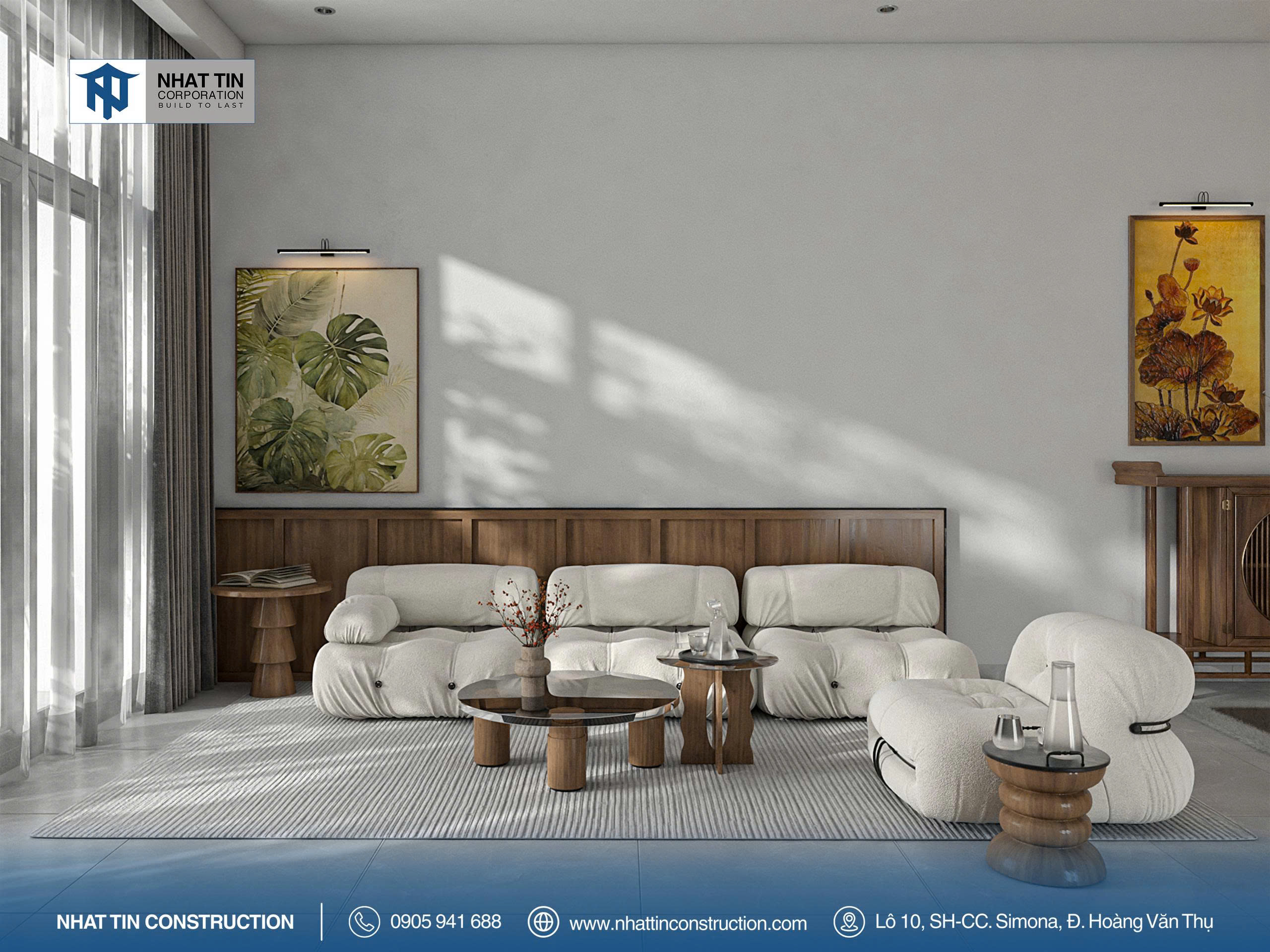 Phòng khách nổi bật với bộ sofa trắng, kết hợp cùng bàn trà gỗ nguyên khối và tranh nghệ thuật tông đất ấm